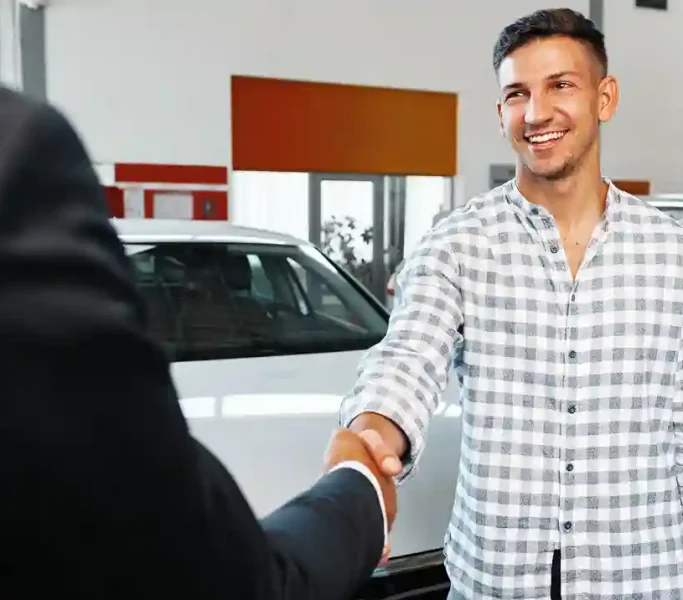 cheerful-young-man-customer-buys-a-new-car-in-a-de-2023-11-27-05-04-20-utc_2_11zon