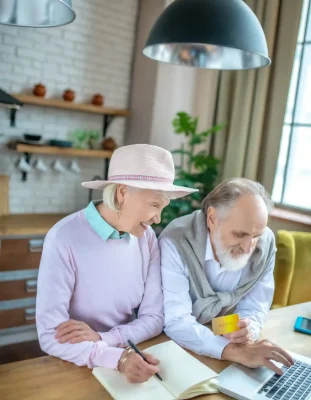 elderly-couple-making-online-payments-with-the-cre-2024-10-11-19-40-54-utc_2_11zon