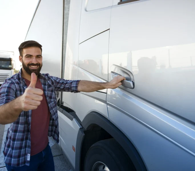 professional-middle-aged-bearded-trucker-standing-by-his-semi-truck-holding-thumbs-up_8_11zon