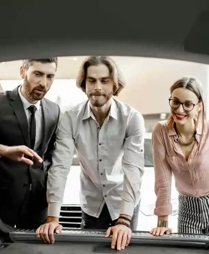 salesman-showing-trunk-of-a-new-car-in-the-showroo-2023-11-27-04-53-10-utc_6_11zon