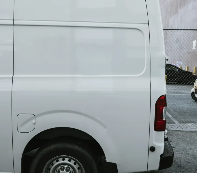 white-delivery-truck-parking-alley_1_11zon